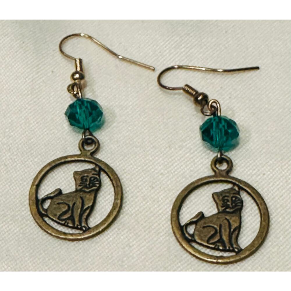 Earrings featuring a cat charm and a blue bead Women’s dangle